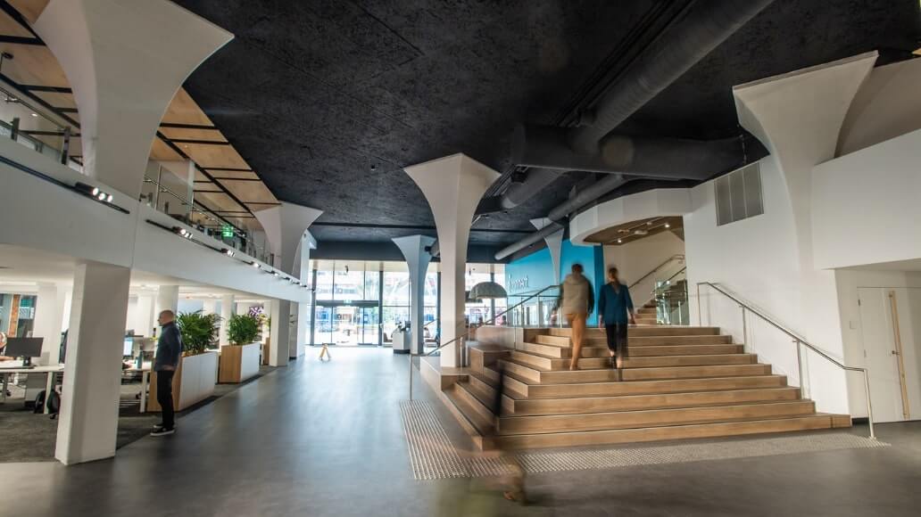 Two people are walking up the staircase at UniSQ Toowoomba, R Block.