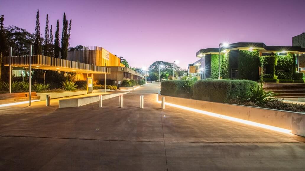 An illuminated pathway on dusk at UniSQ Toowoomba.