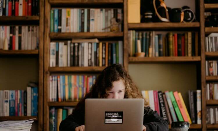 student on laptop at home