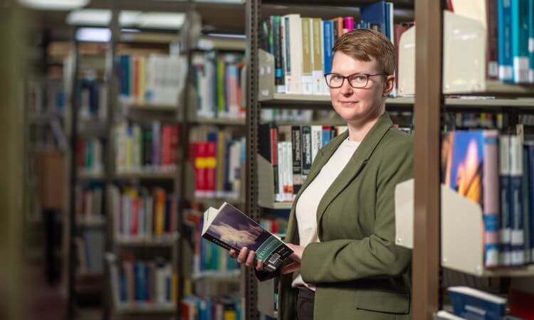 woman standing in library