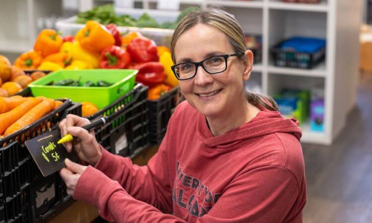 woman with food in the background