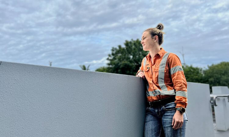 woman looking out over rail 