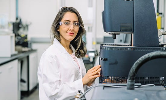 Scientist using laboratory equipment.